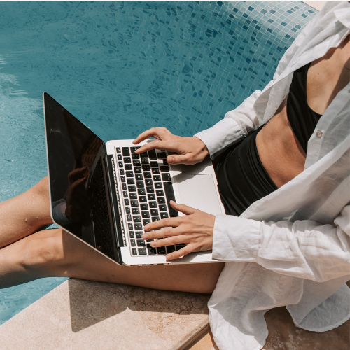 Photo of woman with work-life balance enjoying her day by the pool.