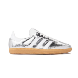 Adidas Silver Stompers sneakers with metallic silver finish and sporty design, displayed on a clean surface, highlighting their stylish and modern athletic look.