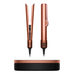 Dyson Airwrap hair straightener in sleek metallic design, shown on a clean surface, highlighting its modern technology and styling capabilities as a premium hair tool gift.