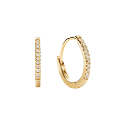 Mejuri Diamond Huggie Hoops in gold with small sparkling diamonds, displayed on a clean surface, highlighting their delicate and elegant design for everyday luxury.