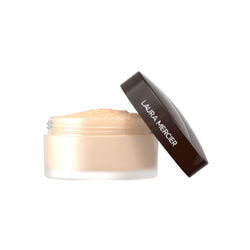 Laura Mercier Translucent Loose Setting Powder in a round jar with a minimalist design, displayed on a clean surface, highlighting its lightweight, mattifying formula for a flawless makeup finish.
