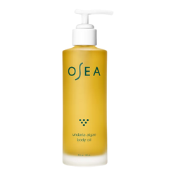 OSEA Undaria Algae Body Oil in a sleek amber bottle, displayed on a clean surface, highlighting its nourishing, algae-infused formula for hydrated and glowing skin.