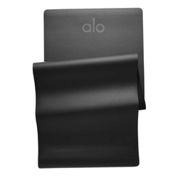 Alo Yoga Warrior Mat in a sleek, muted color, displayed flat on a clean surface, highlighting its cushioned, non-slip design for comfortable and stylish yoga practice.