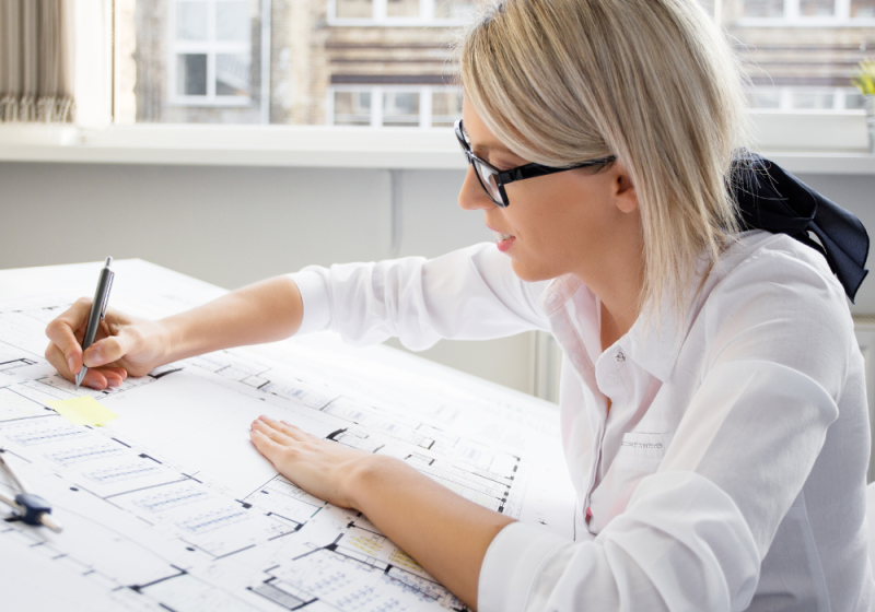 Professional female working at her desk and maintaining her creative energy.