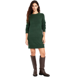 Long-sleeve sweater dress styled with a belt, tall boots, and a knit cardigan for a chic fall capsule wardrobe outfit.