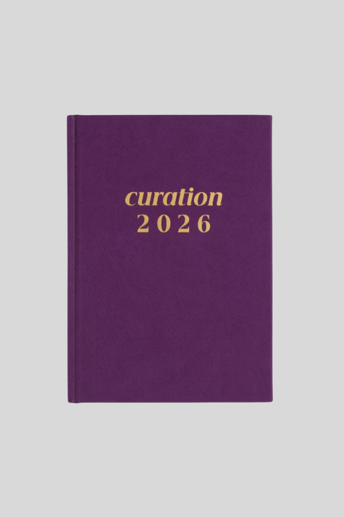 Curation 2026 Planner with minimalist hardcover design and gold embossed text.