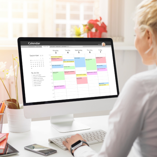 Family using a digital planner to plan their week.
