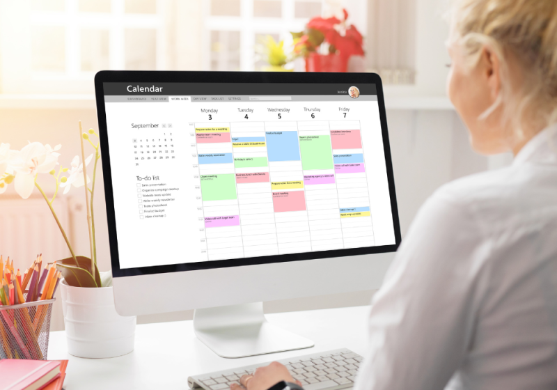 Family using a digital planner to plan their week.