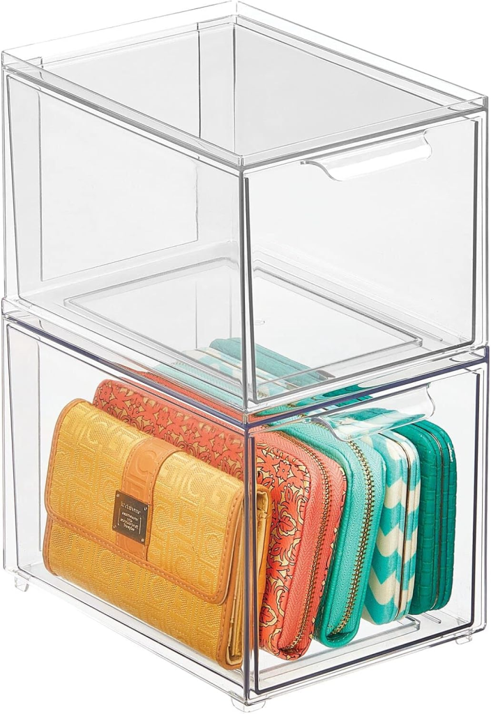 Organized kitchen pantry using clear storage bins and pull-out drawers.