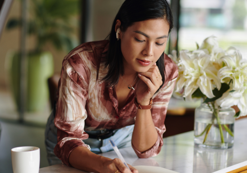 Busy professional female planning her day to optimize her time and efficiency.