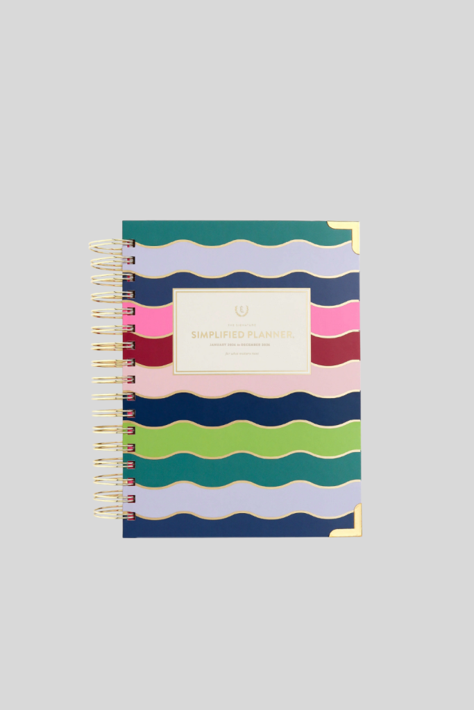 Simplified Planner by Emily Ley open on a desk, displaying clean and minimal daily and monthly layouts for organizing tasks, appointments, and goals.