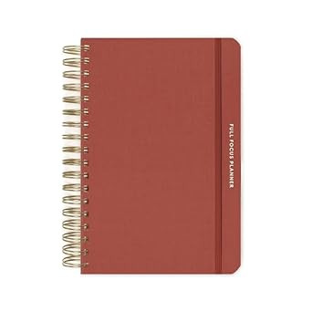 Full Focus Planner open to a daily or weekly layout with goal-setting, priorities, and task-tracking sections, designed for productivity, time management, and organized planning.