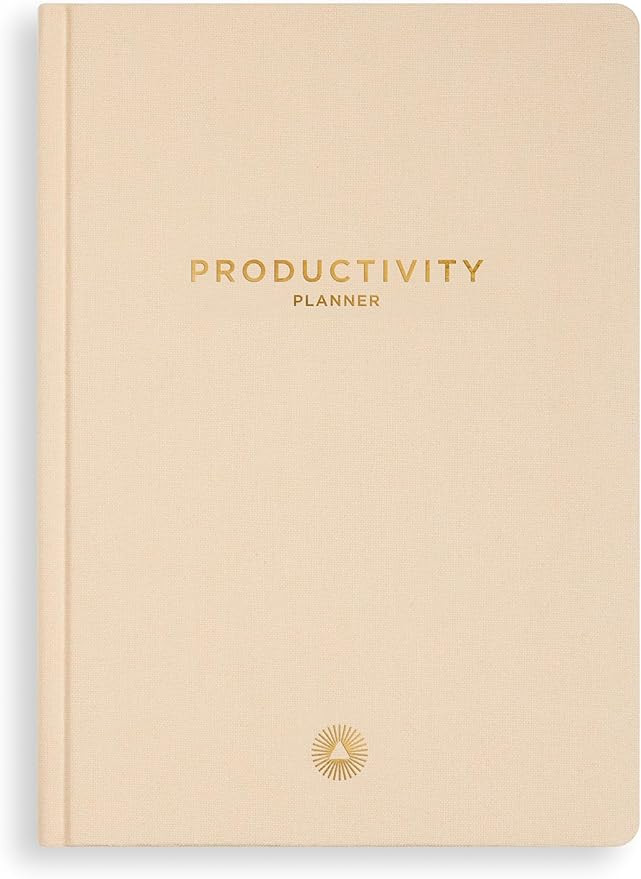 Open productivity planner showing daily schedule, to-do lists, and goal-setting sections, designed for organized and efficient planning.
