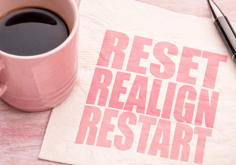 Image of a coffee cup and napkin showing reset, realign and restart.
